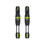 Pair of black ski bindings with green accents on a white background