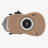 Brown textured device with circular component on a white background